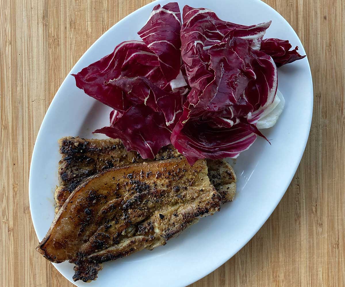 Cromwell Farm Pork with fennel dust and raddichio on the side 