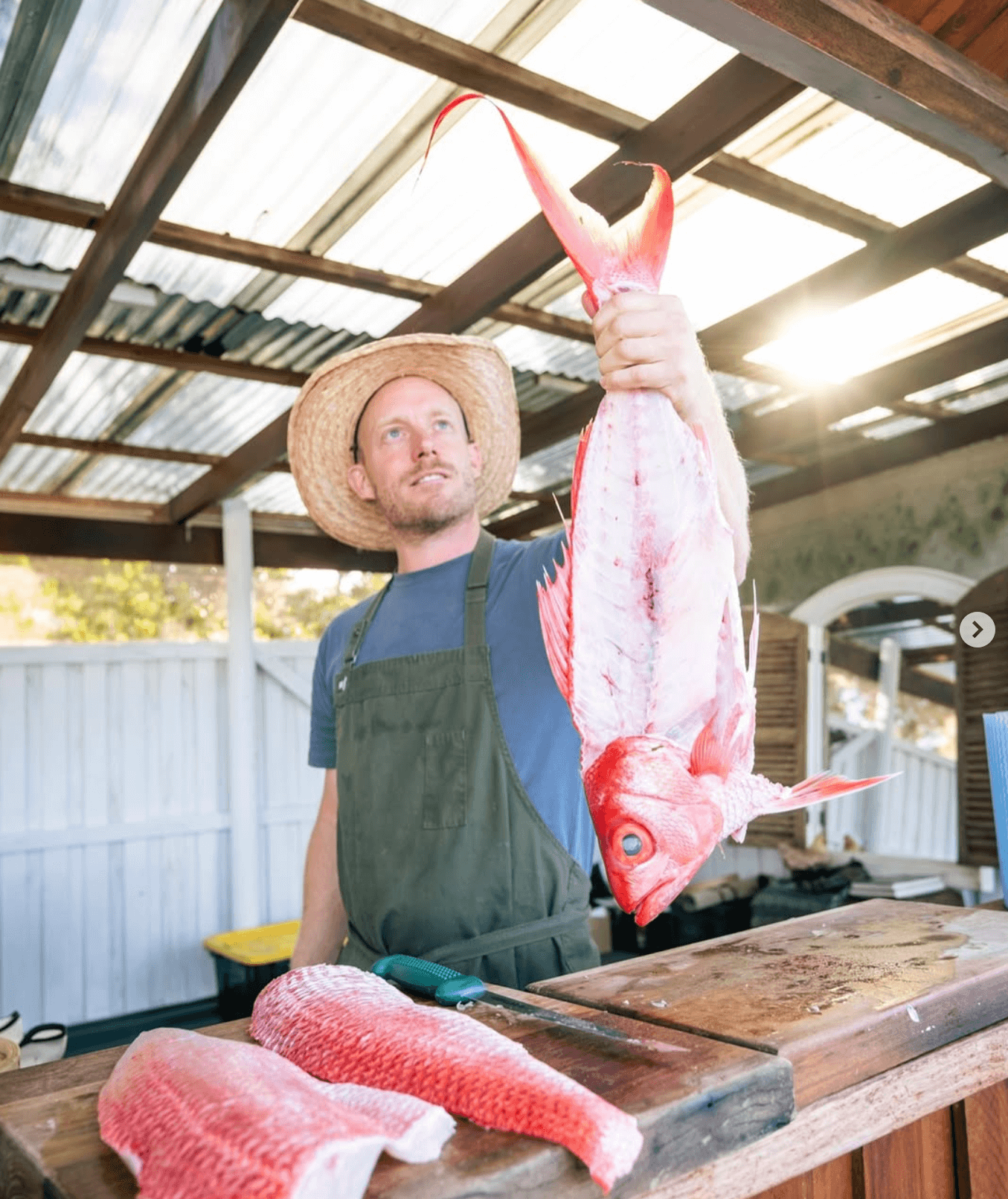 Chef Wal Foster holds up a fish